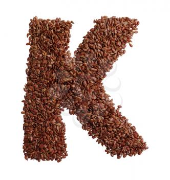 Letter K made with Linseed also known as flaxseed isolated on white background. Clipping Path included