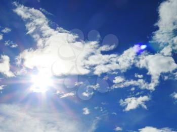 white fluffy clouds closeup in the blue sky