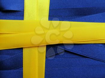 SWEDEN flag or banner made with blue and yellow ribbons