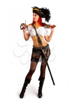 sexy girl in a pirate costume and a cocked hat stands armed with a gun and a sword on a white background
