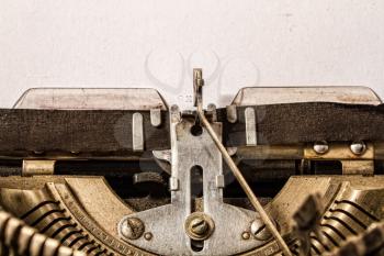 old classic typewriter with a sheet of paper close up