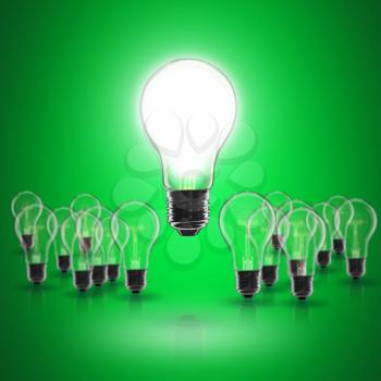 Idea and  leadership concept -  incandescent light bulb on the black background