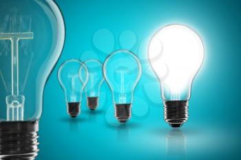 Idea and  leadership concept -  incandescent light bulb on the black background