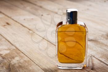 perfume bottle on the wooden background
