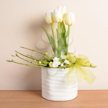 Interior decoration, decorative white tulips in the white flowerpot.