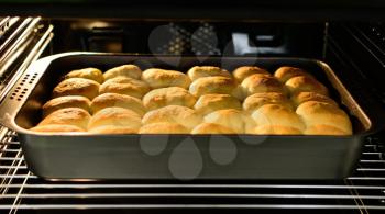A View into the Baking Oven with Traditional Czech Curd Cakes in the Pan.