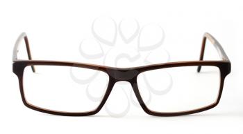 Closeup of brown modern eyeglasses on white background.