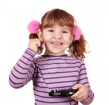 happy little girl play video game and win