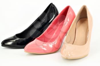 ocher pink and black women shoes on white