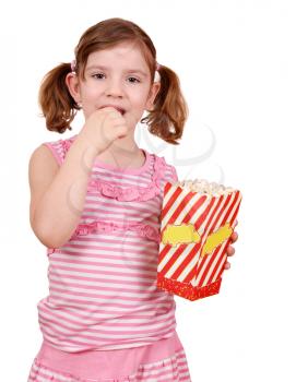 little girl eat popcorn on white