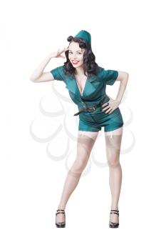 Portrait of Cute Sexy Brunette with black hair. Pin up Female Dressed in military clothing Uniform and Garrison cap saluting. Army Pin-up Girl Concept