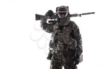 Army special forces soldier, commando shooter, mercenary in camouflage uniform, bonnie, hidden behind mask and glasses face, armed service rifle, carrying backpack on back, isolated studio shoot