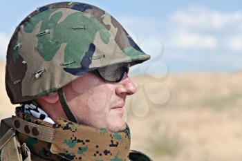 soldier in the military helmet half-turned to the camera