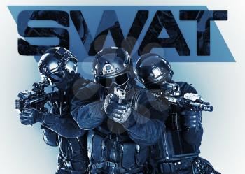Studio shot of swat police special forces black uniforms pointing terrorists automatic rifle. Tactical helmet goggles. Isolated on white front view