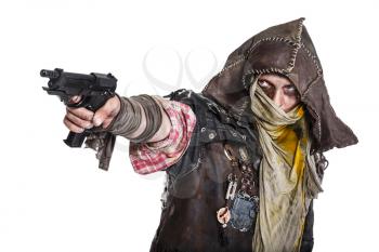 Nuclear post apocalypse life after doomsday concept. Grimy survivor with homemade weapons aiming a gun. Studio closeup portrait on white background