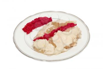 Plate with jellied meat isolated on white.