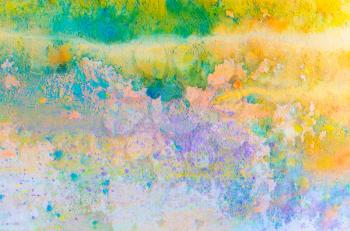 Abstract colorful background with holi paint powder. Rainbow powder. Indian dyes splatted background.