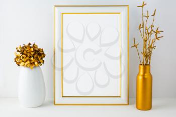 Frame mockup with white and golden vases. Portrait or poster white frame mockup. Empty white frame mockup for design presentation.