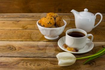 Cup of tea and porcelain teapot. Sweet pastry. Sweet dessert. Homemade biscuit. Breakfast cookies