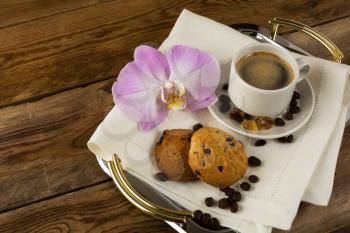 Romantic coffee served with orchid on the serving tray. Coffee cup. Cup of coffee. Strong coffee. Coffee mug. Morning coffee. Coffee break.