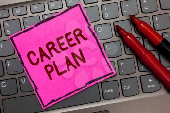 Text sign showing Career Plan. Conceptual photo ongoing process where you Explore your interests and abilities Pink paper keyboard Inspiration communicate ideas messages Red markers