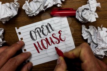Handwriting text Open House. Concept meaning you can come whatever whenever want Make yourself at home Man holding marker notebook page crumpled papers several tries mistakes