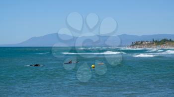 CABO PINO, ANDALUCIA/SPAIN - JULY 2 : People Surfing at Cabo Pino Andalucía Spain on July 2, 2017. Unidentified people.