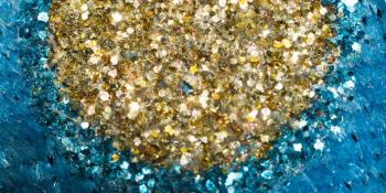 Macro view of colorful glitter, abstract defocused background.