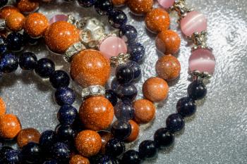 Fashion bracelets made of blue and gold sandstones, aventurine beads.