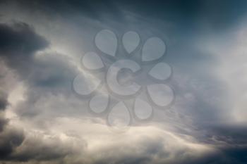 Stormy sky with dark heavy clouds background.