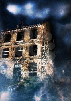 Old abandoned ruined building and the dark night sky, photo manipulation.
