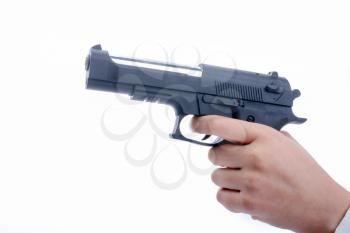 hand holding and pointing a toy gun on white background