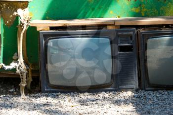 A Broken Television Abandoned on the ground outside in the street