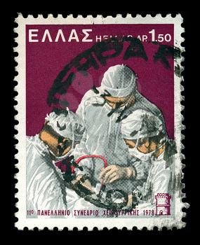 GREECE - CIRCA 1978. Vintage postage stamp printed by the Hellenic Post for the 11th Panhellenic Congress of Surgery shows operating surgeons and White Tower of Thessaloniki illustration, circa 1961.