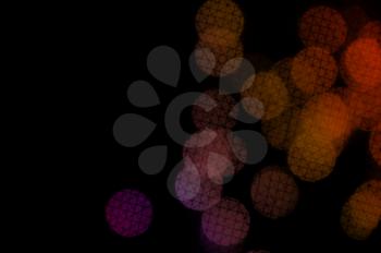 Colorful circles with crosshatch line pattern abstract blur on black background.