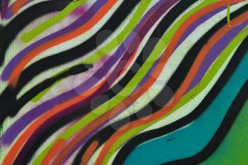 Abstract colorful lines pattern artistic background. Graffiti spray paint on wall texture.