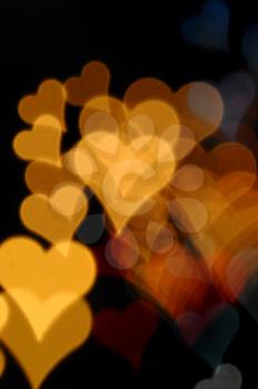 Colorful hearts blurry lights at night. Valentine's day abstract background.