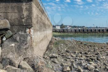 Erosion on a seawall  is revealed at low tide. Location is Des Moiines, Washington.