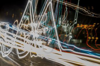 An abstract shot of moving car lights at a slow shutter speed with a bit of a shake.