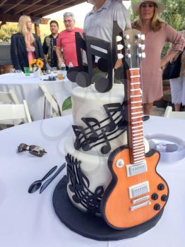 Guitar cake edible musical instrument for birthday with notes black and white with daisy