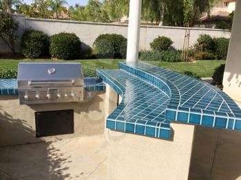 Backyard bbq barbecue built in design gas grille and blue tile counter top