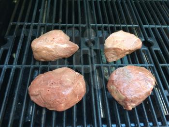 filet mignon on bbq barbecue grill background cooking