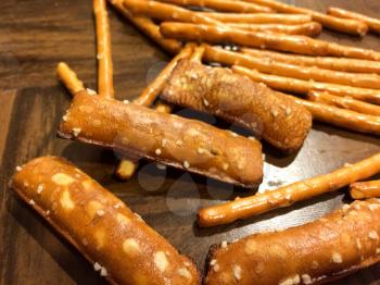 Pretzel sticks salted close up yummy snack on wood table