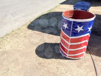 Trash can wrapped in american flag banner concept for recycle problem