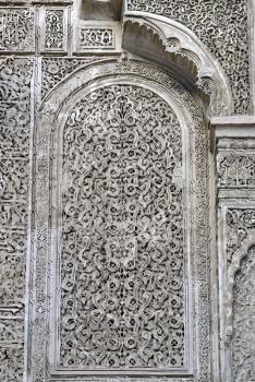 Elaborate decoration of carved patterns in Madrasa Bou Inani, Fez, Morocco