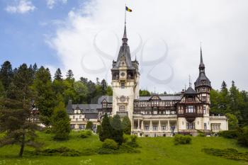 Peles Castle in Sinaia on a bright summer day with blue sky