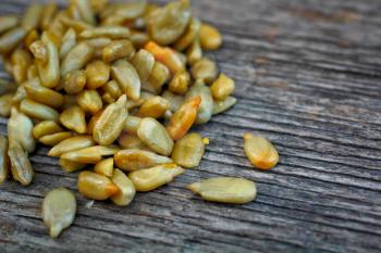 Fresh sunflower seed on a wooden table