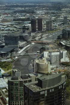 Aerial view of buildings and footbridge in Downtown Melbourne over the Yarra river in Australia 