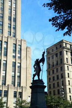 Silhouette of Maisonneuve Monument at Place d'Armes, Montreal, Quebec, Canada in front of Notre dame basilica Sculpture made in 1895 by Pierre-Phillipe Hbert. 