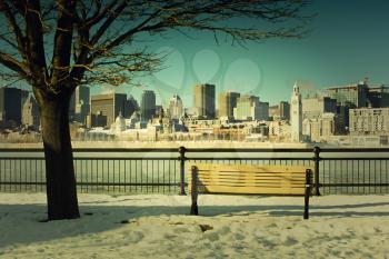 Bench in front of Montreal downtown during winter
